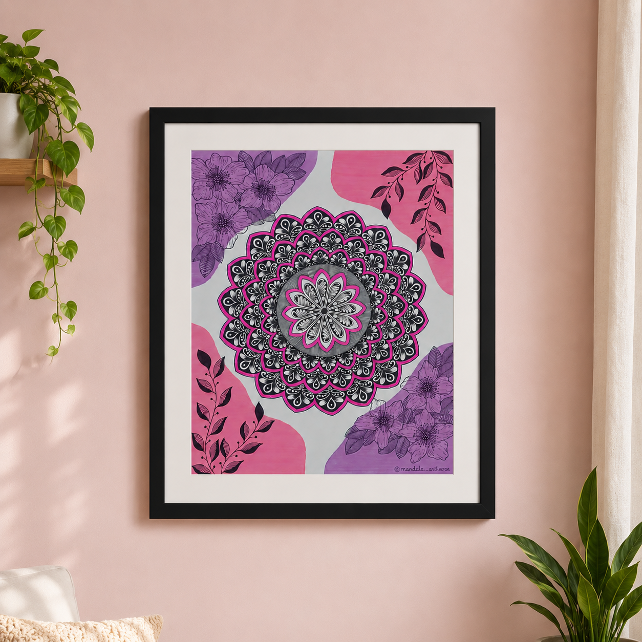 Framed pink and purple mandala on a wall